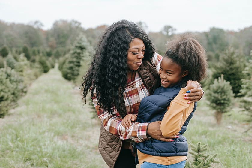 mother and daughter at tree farm
